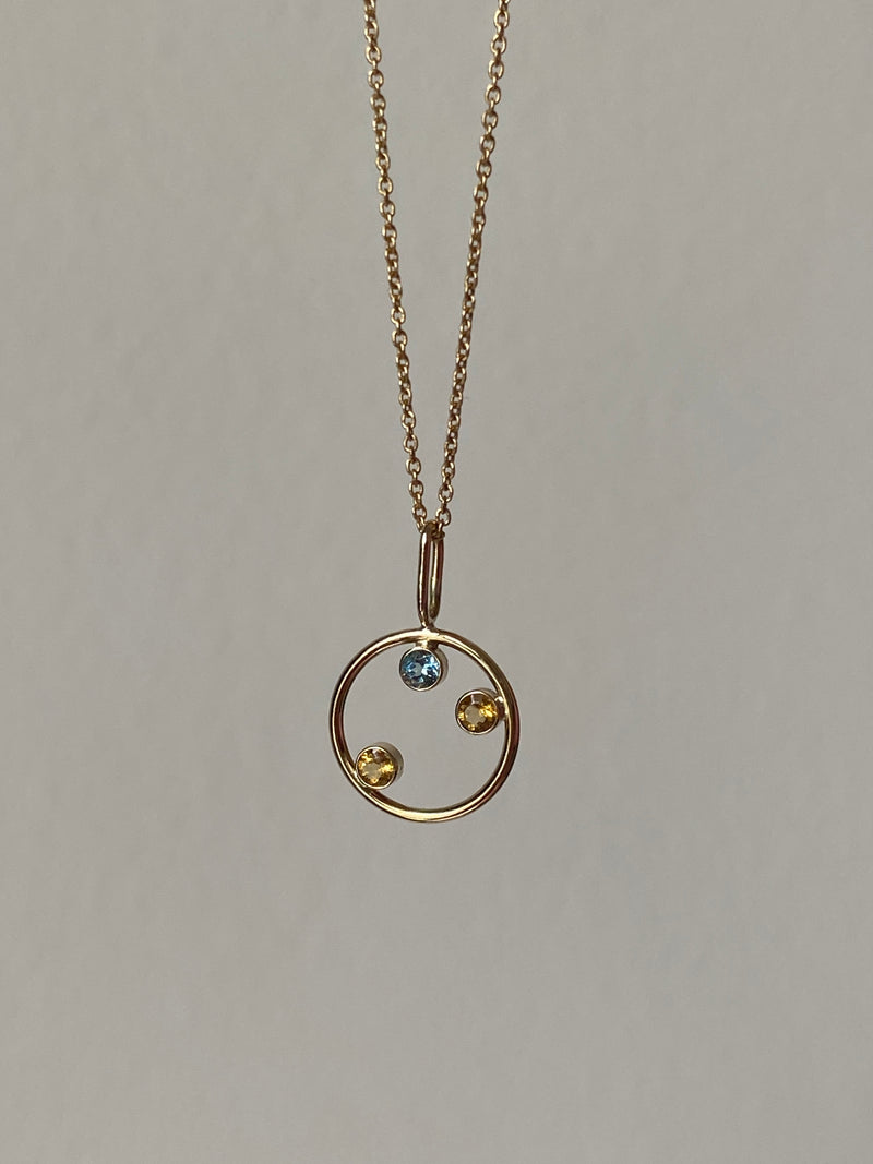 family pendant for a family of three 3. made of 14k solid gold and birthstones. hand craftted in miami.