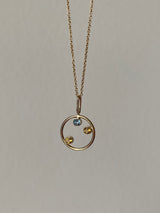 family pendant for a family of three 3. made of 14k solid gold and birthstones. hand craftted in miami.